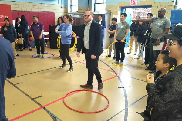 LWS Homecare team member, Donovan Malloy, laughs after very quickly losing the hula hoop competition.