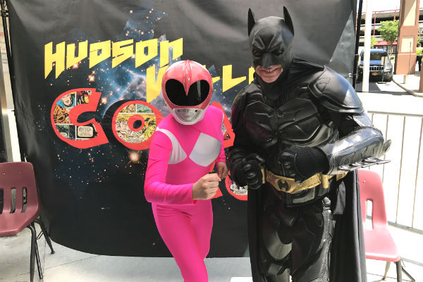 Popular superheroes take pictures with the guests.